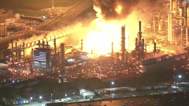 Massive fire at oil refinery in Carson contained after explosion, officials monitoring air quality