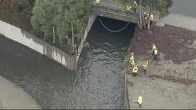 2 people trapped in Lakewood drainage canal, rescue underway