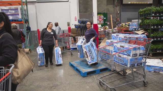 Mass crowds rush to local stores to stockpile goods amid coronavirus concerns