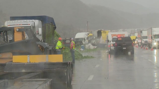 Hay spill, crash involving 2 big rigs snarls traffic on 5 Freeway