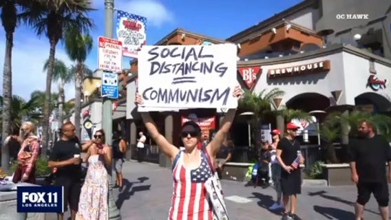 More than 100 protesters call for relaxing quarantine orders in Huntington Beach