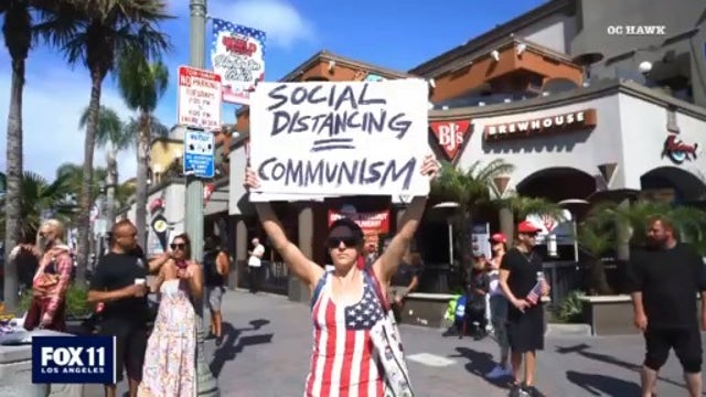 More than 100 protesters call for relaxing quarantine orders in Huntington Beach