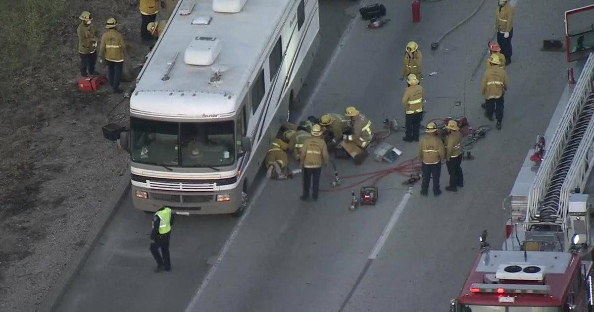 Firefighters rescue man trapped under RV in Sylmar | FOX 11 Los Angeles