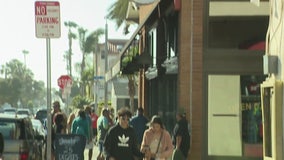 Dozens flock to Huntington Beach as OC businesses reopen