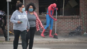 Volunteers clean up trash, graffiti and debris following Twin Cities protests