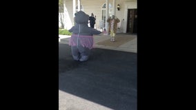 Woman wears sanitized inflatable hippo costume to hug mom living in retirement home