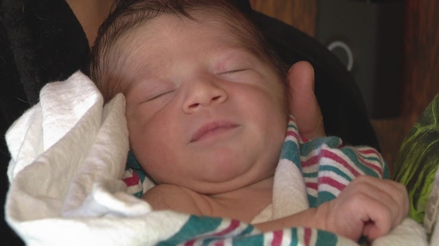 Drive-by celebration welcomes baby of first responder family