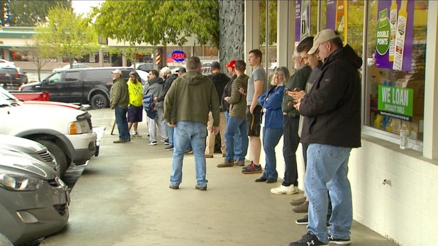 Line stretches out the door at Washington barbershop operating outside of stay-at-home order