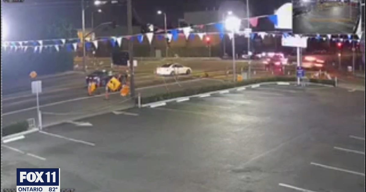 Surveillance video shows tow truck running red light, causing multi ...