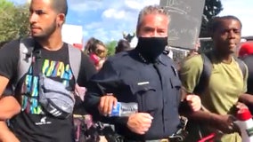 Video shows Denver police chief marching arm-in-arm with protesters at George Floyd demonstration