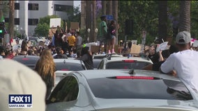 Protesters make their voices heard outside Mayor Garcetti's home in Windsor Square