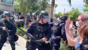 LAPD officers captured on video striking protesters with batons in Fairfax District