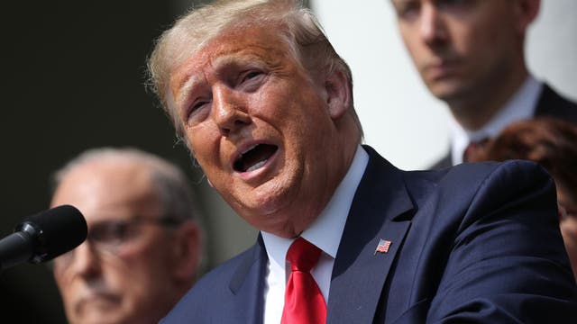 Downplaying coronavirus risk, Trump gets back to business as usual