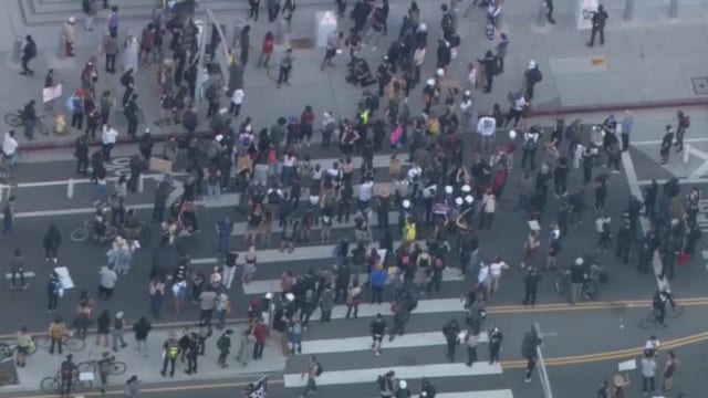 Officers struck by projectiles, protesters shot with nonlethal rounds in downtown LA