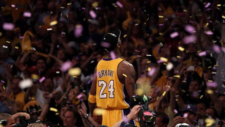 Kobe Bryant is elated as he wears a Laker 2010 Championship cap