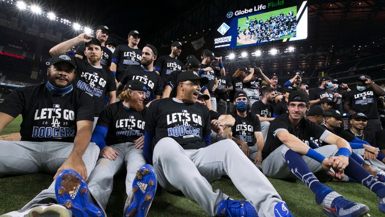 Dodgers celebrate with a team photo on the field