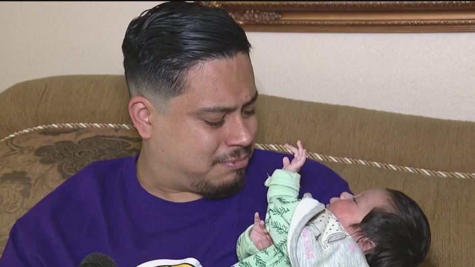 Father and baby who was saved by doctors after accident