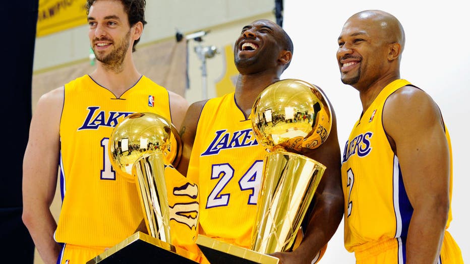 Buy Kobe Bryant with the NBA Championship Trophy after winning