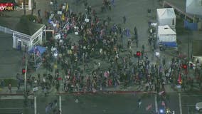 Hundreds gather in Huntington Beach to protest state curfew