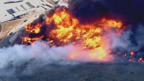 Evacuations lifted for Wilson Fire in Jurupa Valley, that set nearby pallet yard ablaze