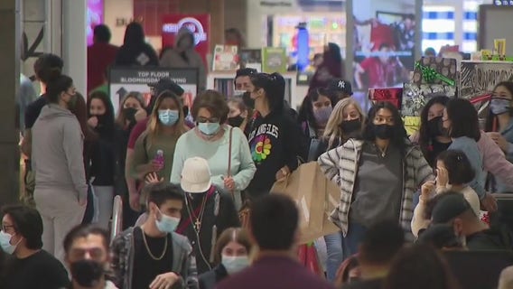 Despite COVID-19 surge, people hit the stores to holiday shop