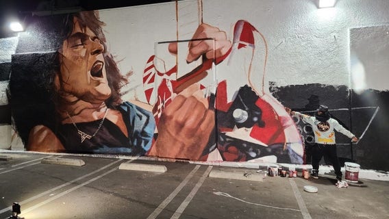 Artist inspired by 'Mamba Mentality' in painting Eddie Van Halen mural