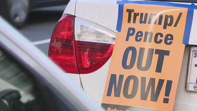 Dozens of demonstrators in DTLA demand President Trump’s immediate removal from office