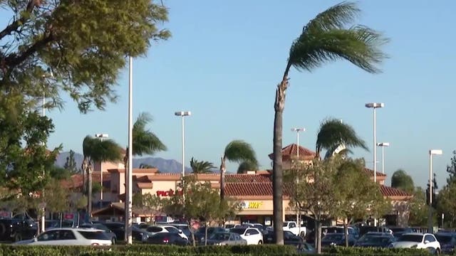 Gusty winds hammer SoCal , prompting warnings of blowing debris, dust