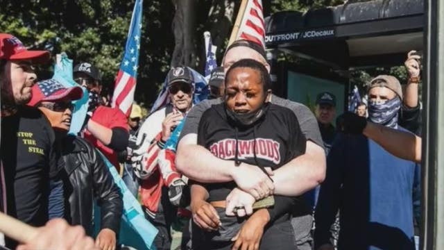 LAPD: Man pictured holding woman in DTLA attack was Good Samaritan trying to pull her to safety