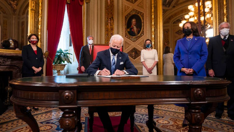 Biden signs executive orders on COVID 19 immigration rejoining