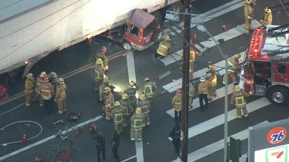 One dead, another injured after car collides into semi-truck in downtown LA