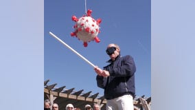 Beating COVID-19: Senior citizens take swing at virus-shaped piñata after getting vaccinated
