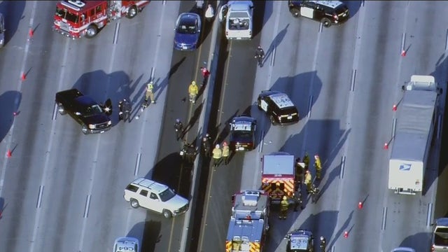 CHP officer struck by vehicle on 10 Freeway in South LA while trying to take pedestrian into custody