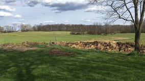 Man builds poop wall in Washtenaw County after dispute with neighbor