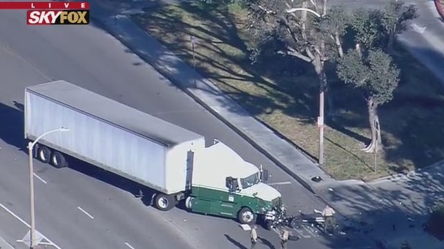 Motorcycle deputy injured in crash involving semi-truck in Valencia