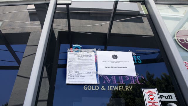 Beverly Hills business raided, accused of helping criminals store guns, cash