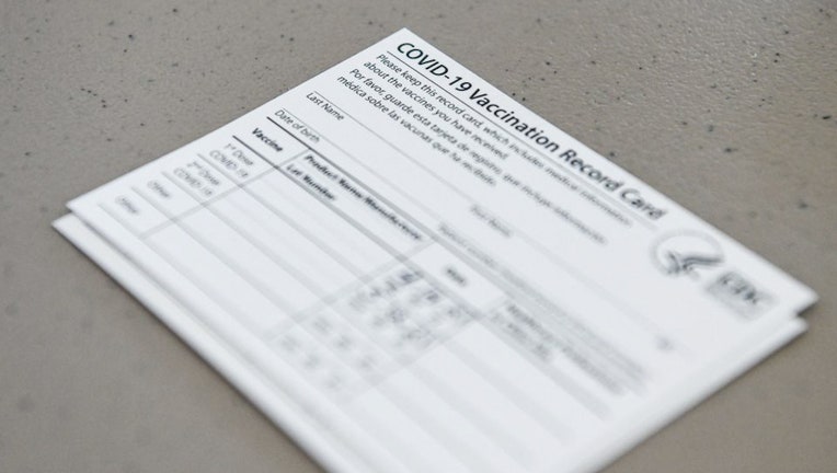 FILE - A Covid-19 vaccine record card is shown in a file image. (CHANDAN KHANNA/AFP via Getty Images)