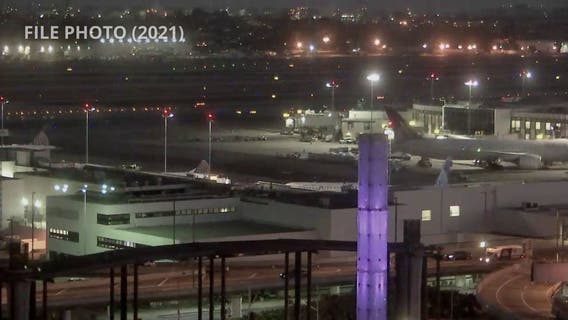 Passenger hits officer and causes scene at LAX after being placed in airport police custody