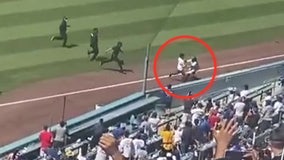 VIDEO: LA Dodgers' ball girl tackles pitch invader during crosstown rivalry game