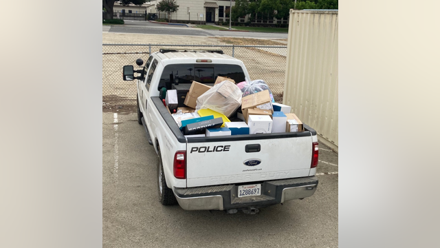 Over $100,000 in stolen property recovered from homeless encampment; suspect search underway