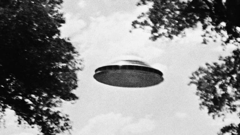UFO Flying Low Over Trees