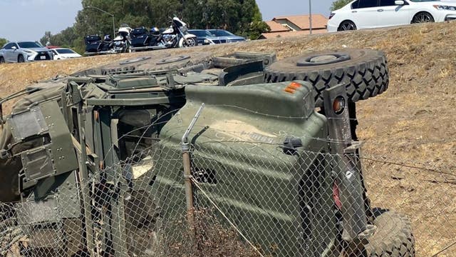 Five injured after military vehicle flips over on 215 freeway in Riverside County