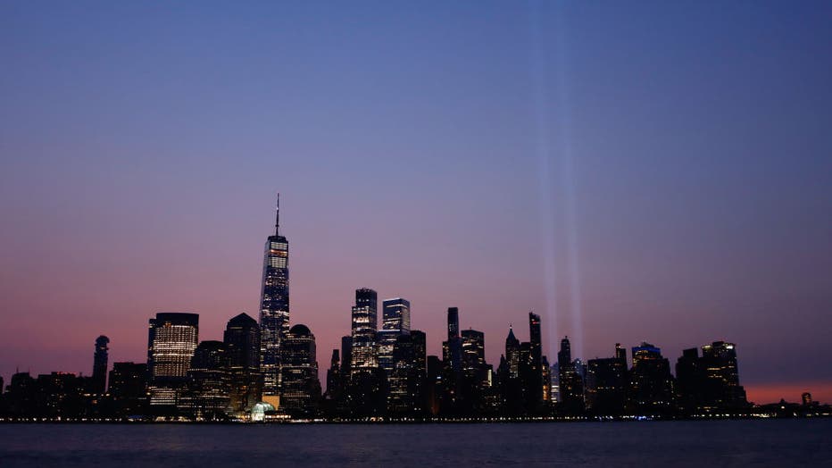 Tribute in Light Fades as the Sun Rises in New York City