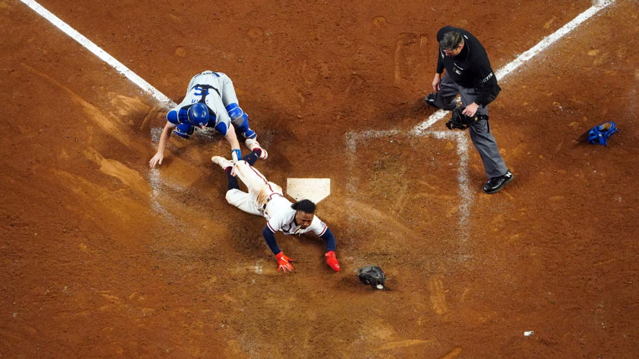 Eddie Rosario of the Atlanta Braves celebrates after hitting a home News  Photo - Getty Images