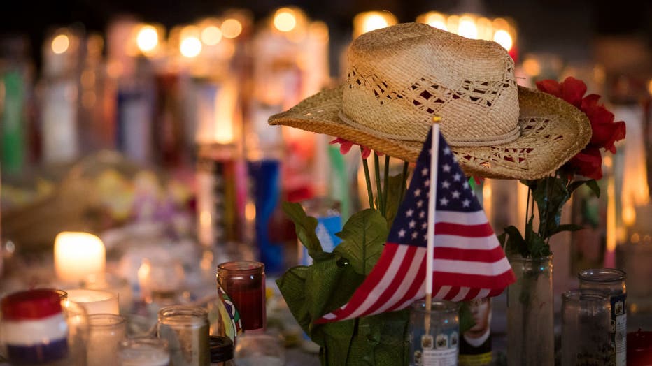 FILE - A hat is left at a makeshift memorial during a vigil to mark one week since the mass shooting at the Route 91 Harvest country music festival on Oct. 8, 2017, in Las Vegas, Nevada. (Photo by Drew Angerer/Getty Images)