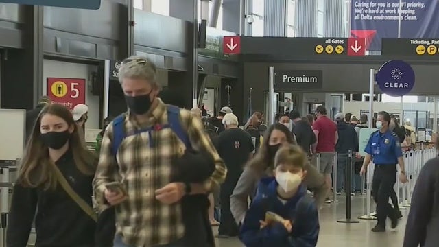 US easing international travel restrictions Monday