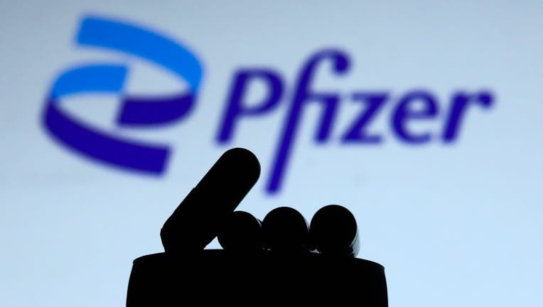 2e37fb29-Pfizer And Omicron Photo Illustrations