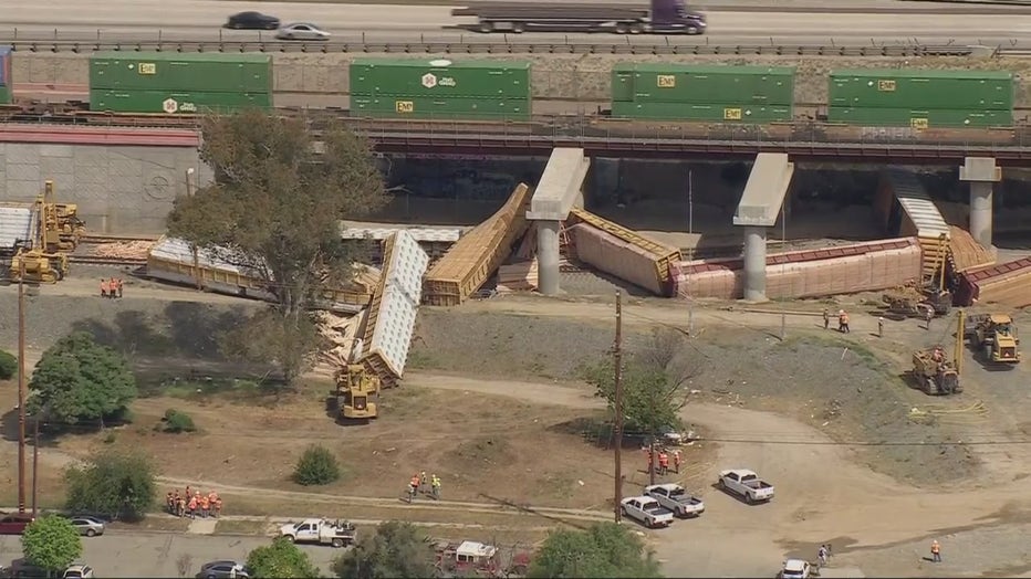 Union Pacific freight train hauling lumber derails, catches fire in Colton, sending 13 cars off tracks