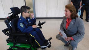 Boy bullied, pushed out of wheelchair at school for dressing as police officer becomes honorary member