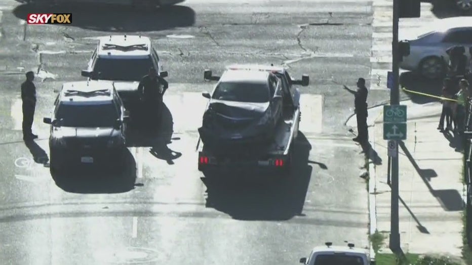 One person is dead and another was rushed to the hospital after a car-to-car shooting in South Los Angeles.